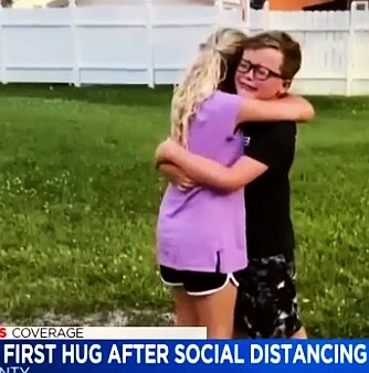 two cousins and best friends first hug after many weeks of social distancing